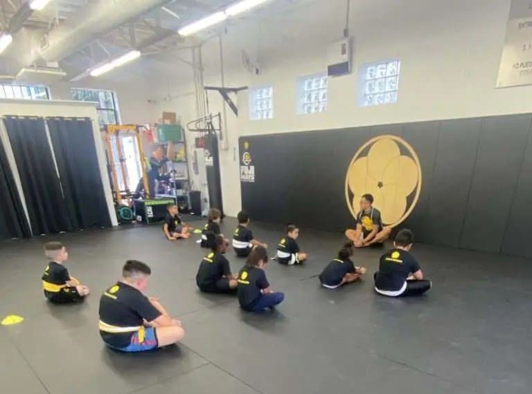 students being calm and showing respect during martial arts class